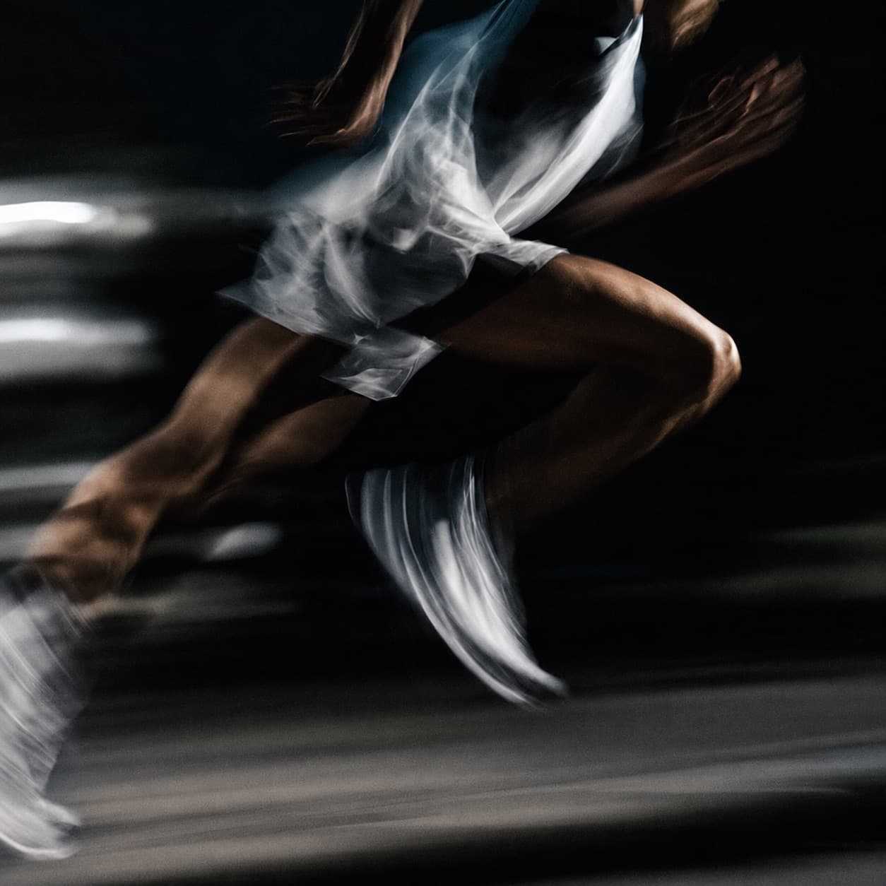Runner mid-stride in motion blur